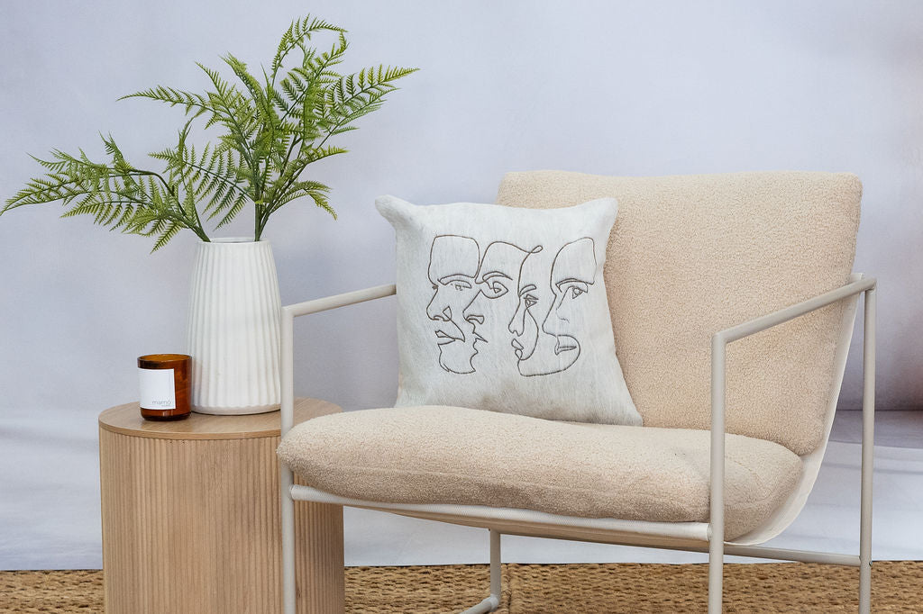 Unique cowhide leather accent cushion with abstract design