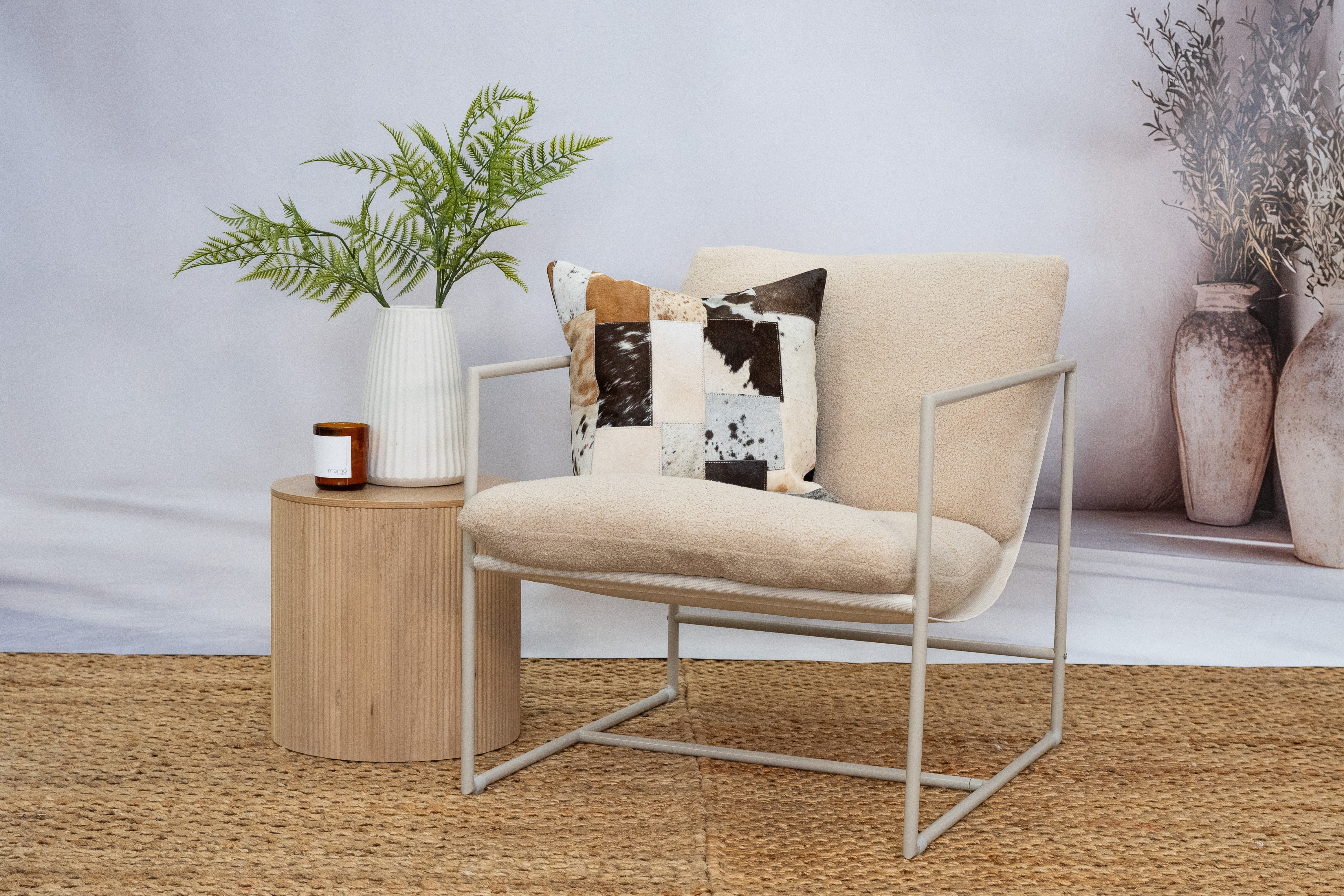 Natural hide patchwork cushion for farmhouse interiors