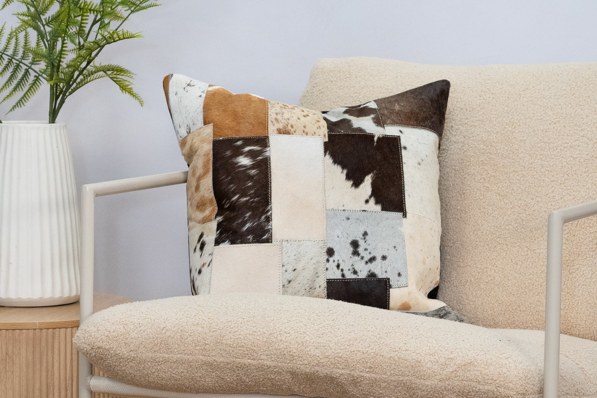Natural cowhide accent pillow for rustic home decor