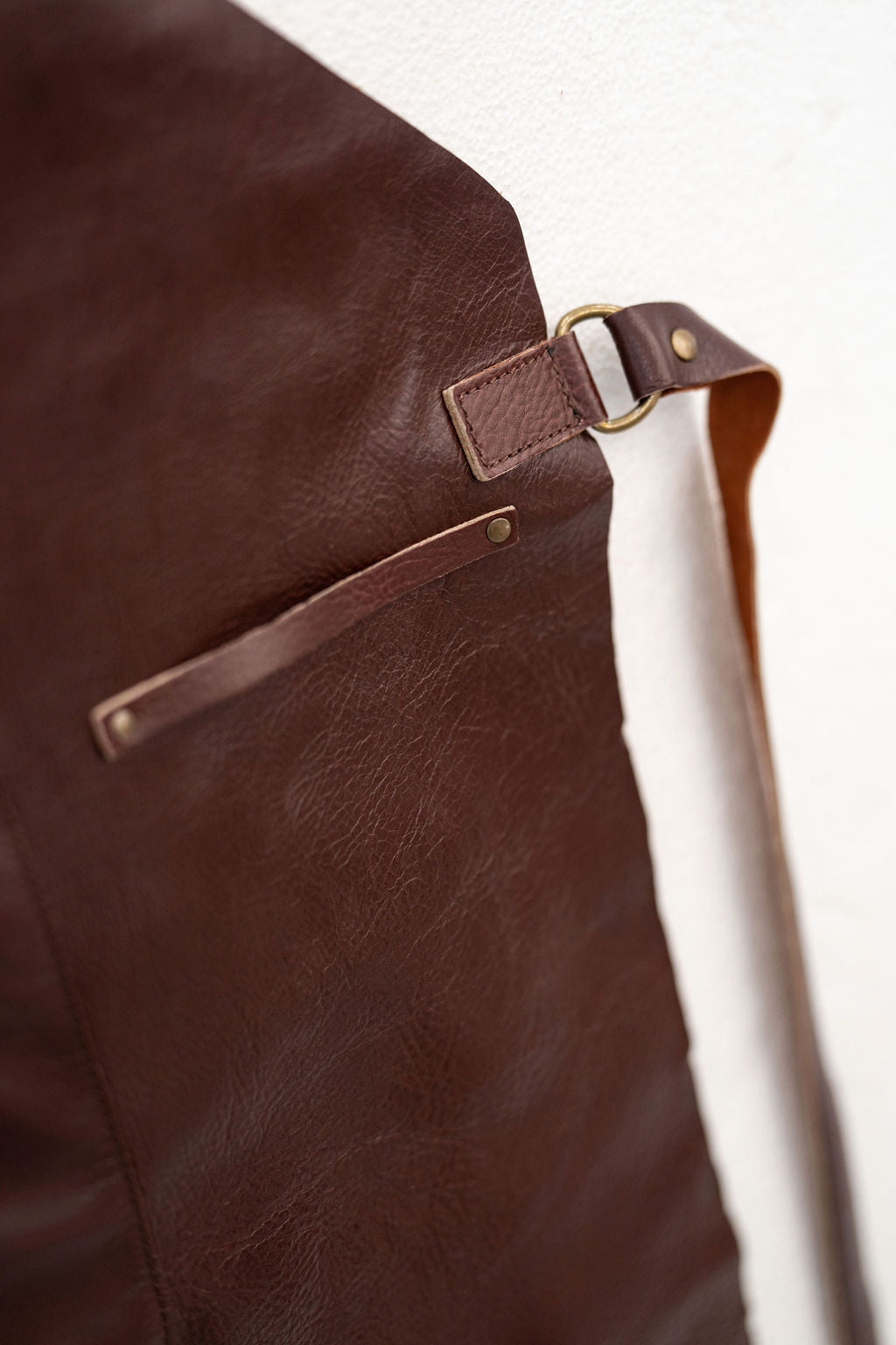 Classic chestnut brown leather apron with practical workwear design