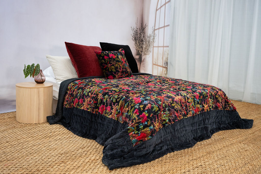 Floral bird print quilt with elegant botanical garden design