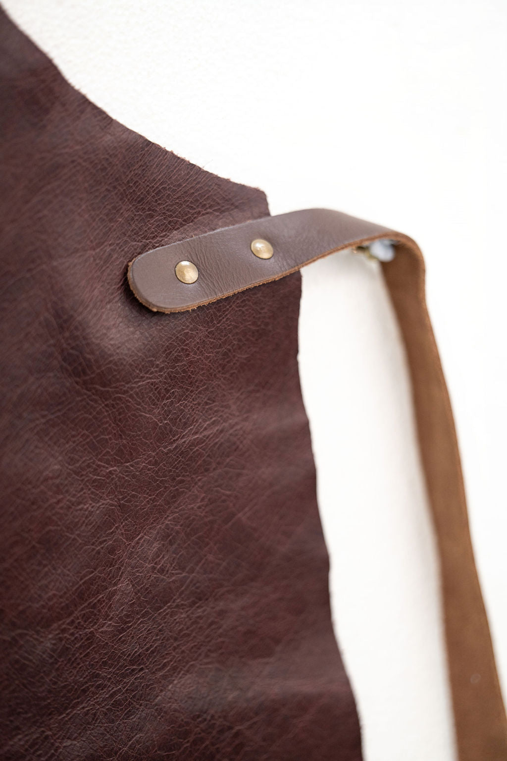 Espresso brown leather apron with durable professional design