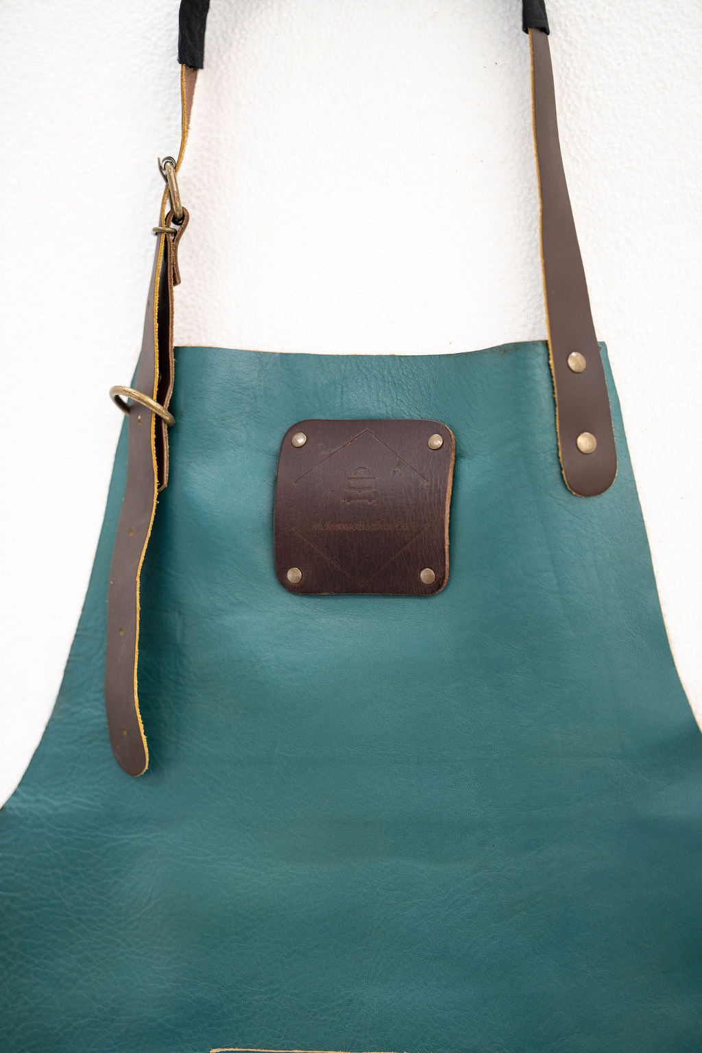 Stylish teal leather utility apron for professional work