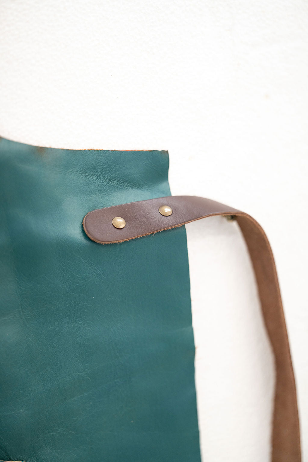 Signature teal leather work apron for makers and creative professionals