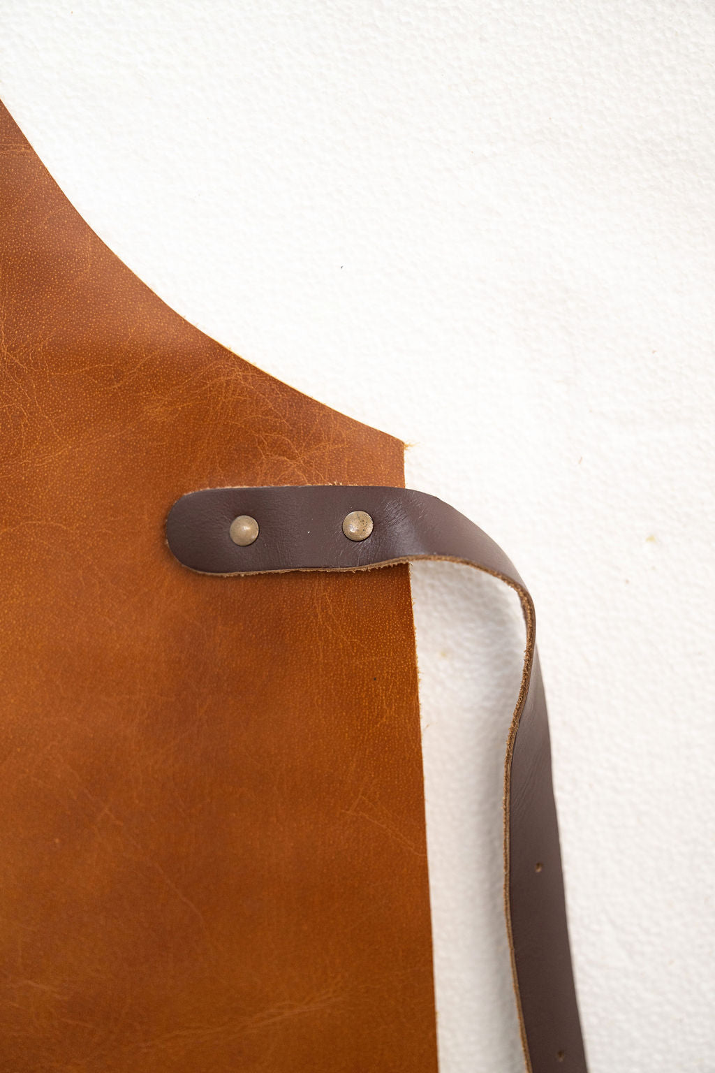 Brown saddle leather apron designed for makers and artisans