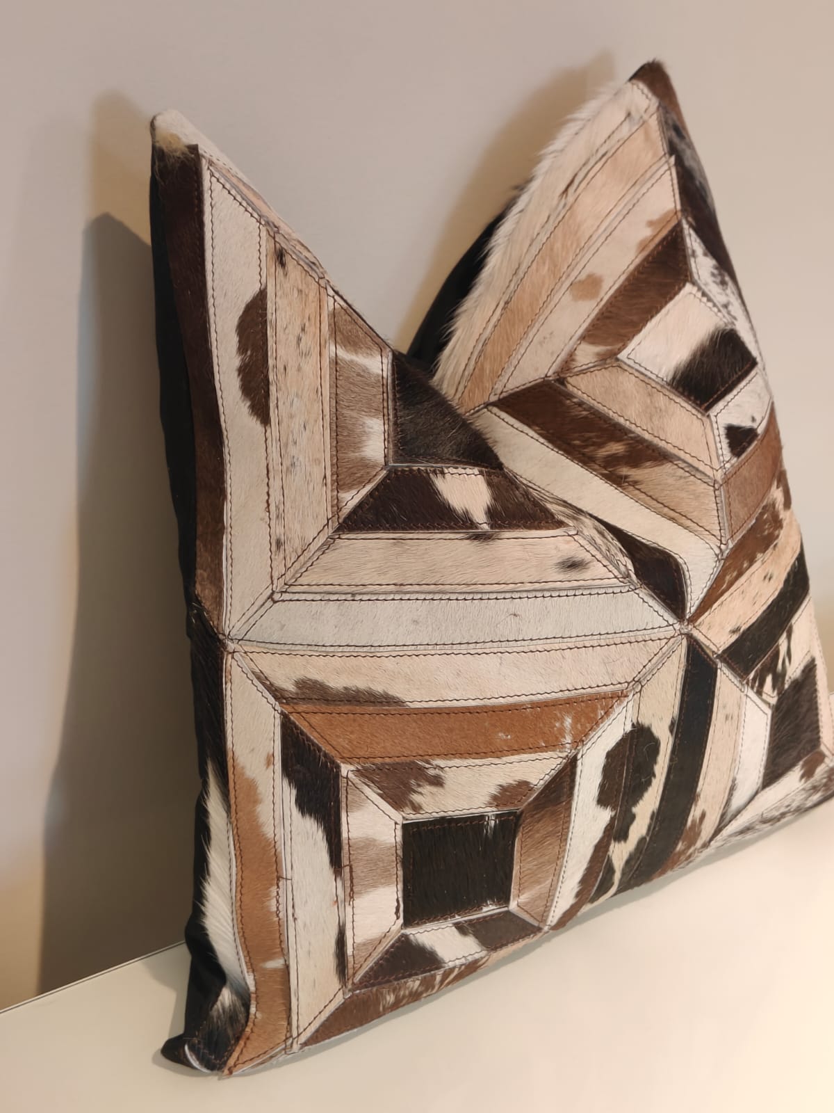 Luxury cowhide cushion with natural rustic charm