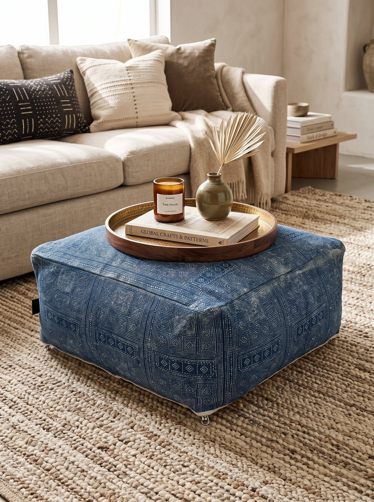 Handwoven blue geometric floor cushion ottoman with decorative patterned design